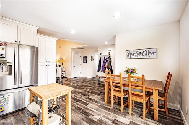 dining room with recessed lighting, dark wood-style flooring, and baseboards