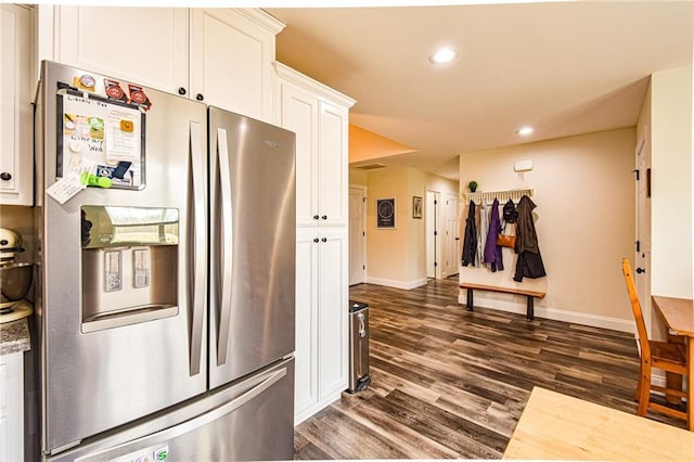 kitchen with recessed lighting, white cabinetry, baseboards, stainless steel refrigerator with ice dispenser, and dark wood-style floors