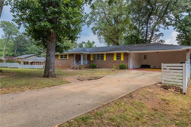 ranch-style home featuring a carport