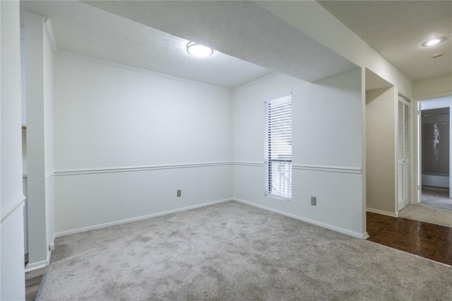 223 Tuxworth Cir, Decatur, GA 30033 - unfurnished room featuring crown molding, carpet floors, baseboards, and a textured ceiling