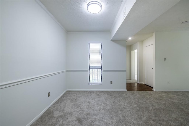 223 Tuxworth Cir, Decatur, GA 30033 - spare room featuring a textured ceiling, baseboards, ornamental molding, and carpet