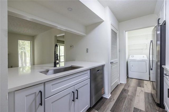 223 Tuxworth Cir, Decatur, GA 30033 - kitchen featuring washer / clothes dryer, appliances with stainless steel finishes, a sink, and light countertops