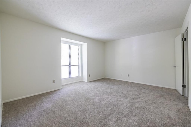 223 Tuxworth Cir, Decatur, GA 30033 - carpeted empty room with baseboards and a textured ceiling