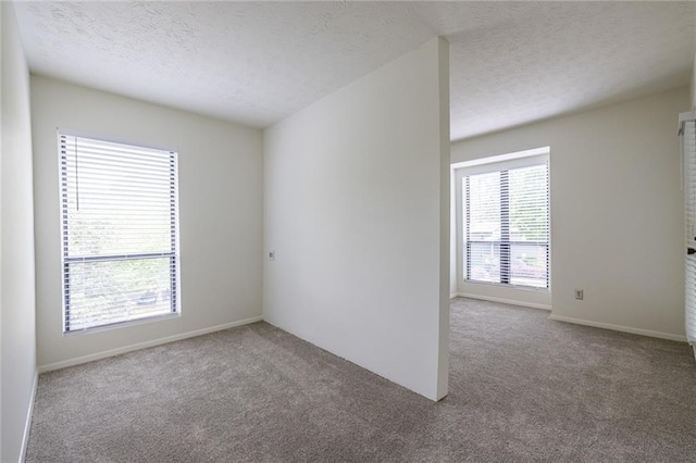 223 Tuxworth Cir, Decatur, GA 30033 - carpeted empty room featuring baseboards and a textured ceiling