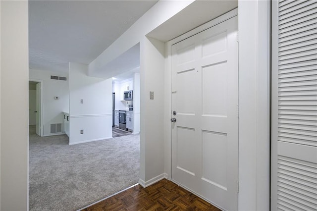 223 Tuxworth Cir, Decatur, GA 30033 - foyer entrance featuring baseboards, visible vents, and dark colored carpet