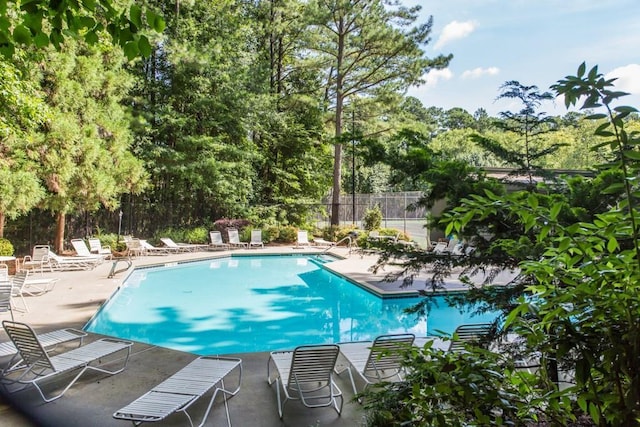223 Tuxworth Cir, Decatur, GA 30033 - pool featuring a patio and fence