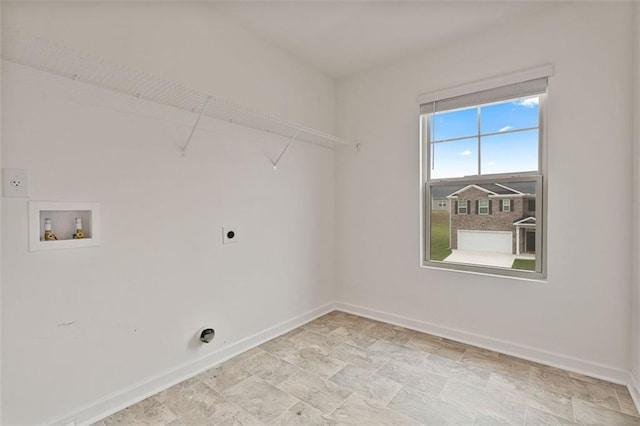 4117 Flat Rock Pt, Stonecrest, GA 30038 - laundry area with hookup for an electric dryer, washer hookup, baseboards, and light stone finish flooring