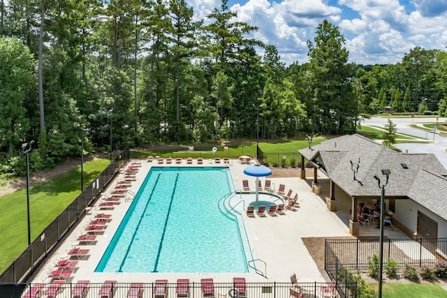 4117 Flat Rock Pt, Stonecrest, GA 30038 - community pool with a patio and view of scattered trees