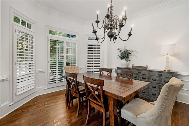 dining space with an inviting chandelier, ornamental molding, and dark hardwood / wood-style floors