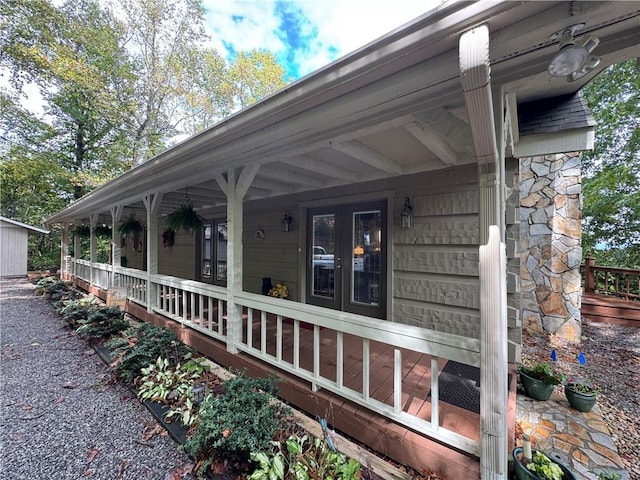 view of side of property with covered porch