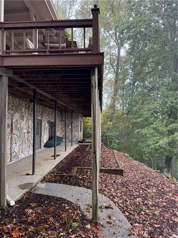 exterior space with a deck and a patio area