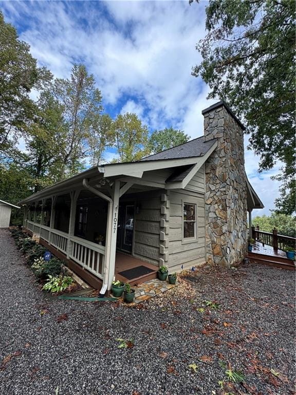 view of property exterior with covered porch