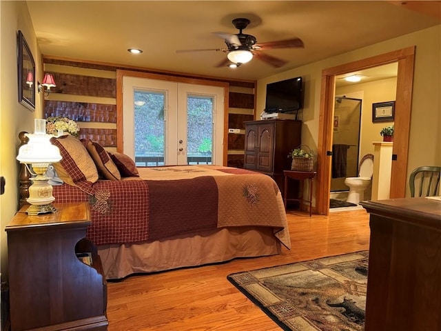 bedroom featuring access to exterior, light hardwood / wood-style flooring, connected bathroom, ceiling fan, and french doors