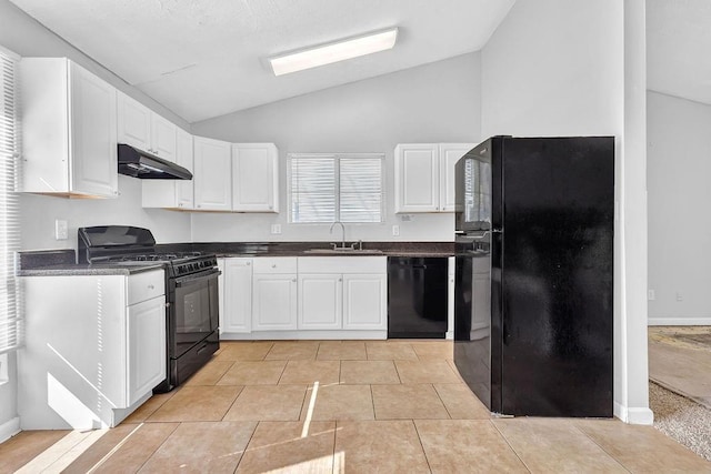 5338 Timor Trl, Lithonia, GA 30038 - kitchen with black appliances, under cabinet range hood, vaulted ceiling, a sink, and dark countertops