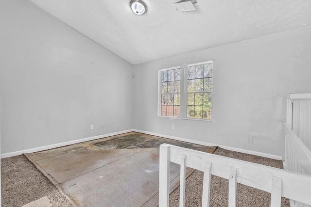 5338 Timor Trl, Lithonia, GA 30038 - carpeted empty room with vaulted ceiling and baseboards