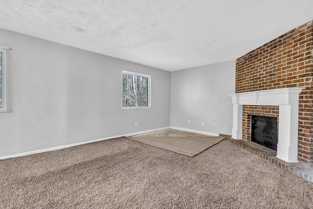 5338 Timor Trl, Lithonia, GA 30038 - unfurnished living room with carpet floors, a textured ceiling, baseboards, and a fireplace