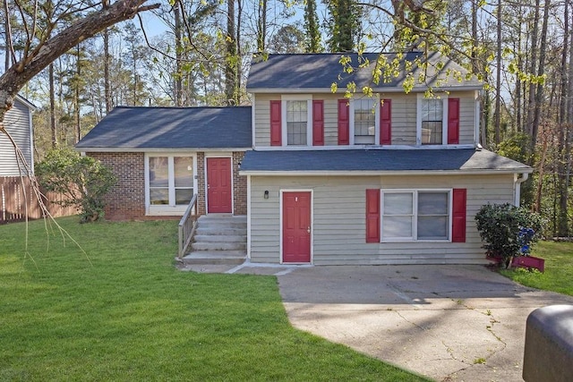 5338 Timor Trl, Lithonia, GA 30038 - view of front facade with a shingled roof and a front yard