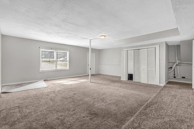 5338 Timor Trl, Lithonia, GA 30038 - unfurnished bedroom featuring carpet floors, a textured ceiling, and baseboards