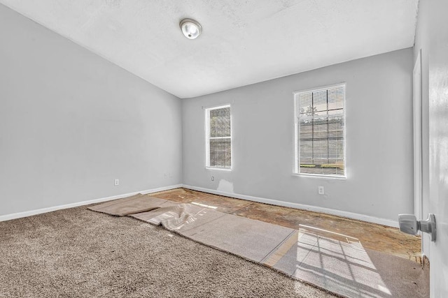 5338 Timor Trl, Lithonia, GA 30038 - carpeted spare room with baseboards and vaulted ceiling