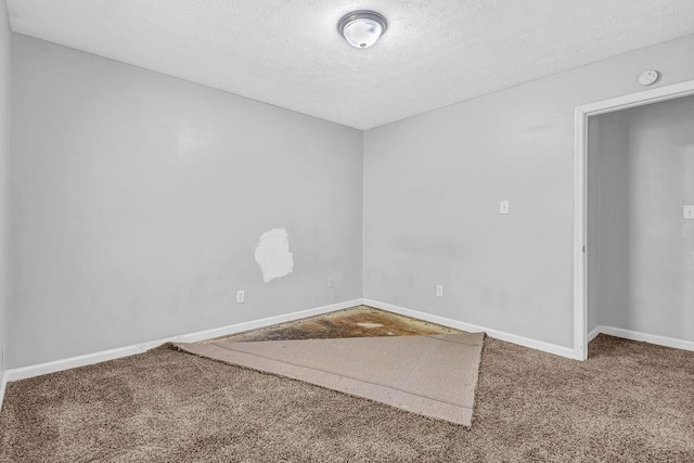 5338 Timor Trl, Lithonia, GA 30038 - carpeted spare room featuring a textured ceiling, baseboards, and a smoke detector