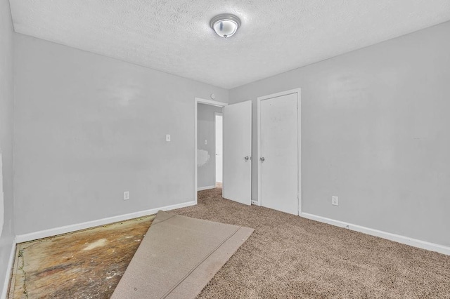5338 Timor Trl, Lithonia, GA 30038 - unfurnished room featuring a textured ceiling, baseboards, and carpet flooring