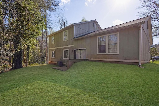 5338 Timor Trl, Lithonia, GA 30038 - back of house featuring a lawn and cooling unit