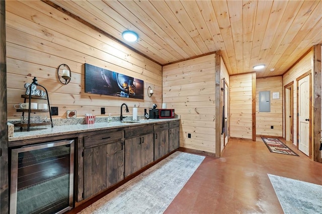 bar with wooden ceiling, beverage cooler, a sink, electric panel, and finished concrete floors