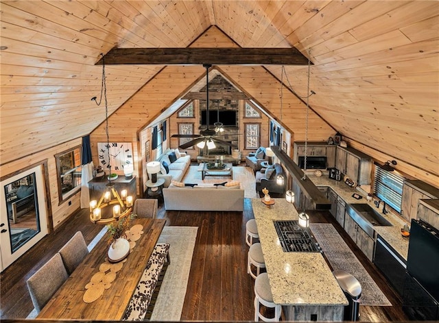 unfurnished living room with vaulted ceiling, wooden ceiling, hardwood / wood-style flooring, and wooden walls