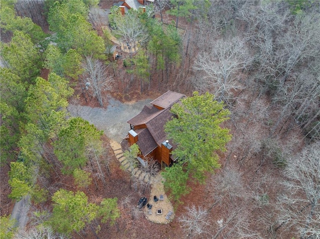 drone / aerial view featuring a wooded view