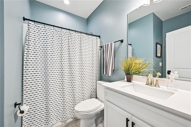 215 Dragonfly Way, Winder, GA 30680 - bathroom featuring toilet, vanity, and curtained shower