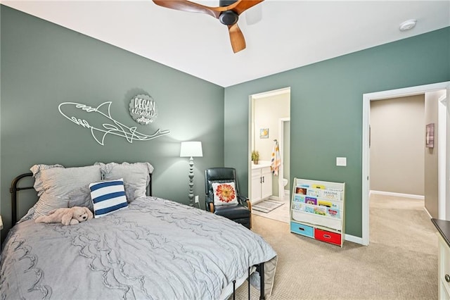 215 Dragonfly Way, Winder, GA 30680 - bedroom featuring light colored carpet, connected bathroom, baseboards, and ceiling fan