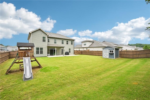 215 Dragonfly Way, Winder, GA 30680 - rear view of property featuring a patio area and a playground
