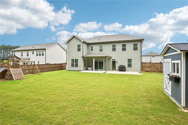 215 Dragonfly Way, Winder, GA 30680 - back of property featuring a playground and a patio