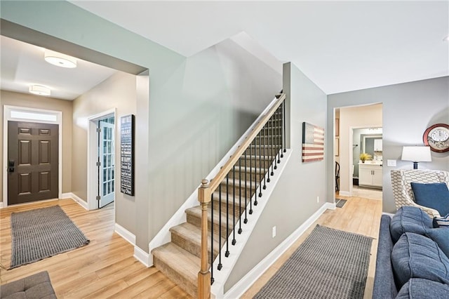 215 Dragonfly Way, Winder, GA 30680 - entrance foyer with light wood-style floors, baseboards, and stairway