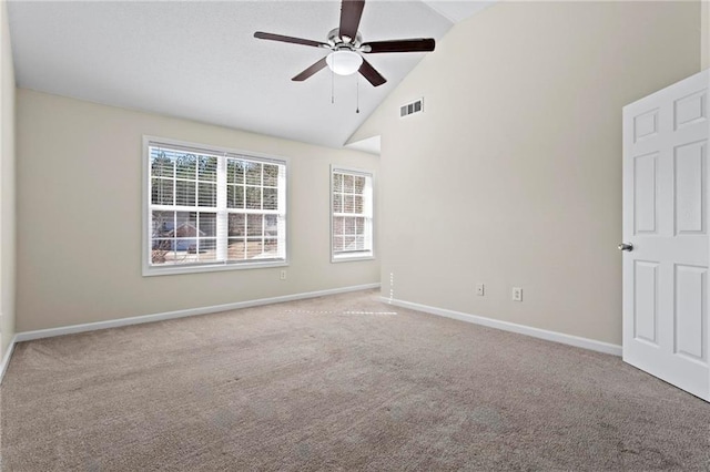 unfurnished room featuring ceiling fan, light colored carpet, and high vaulted ceiling