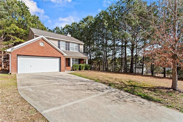 view of front of home featuring a garage and a front yard