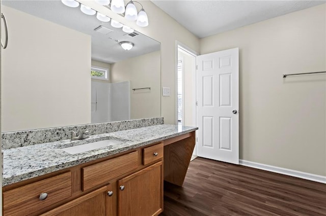 bathroom featuring vanity and wood-type flooring