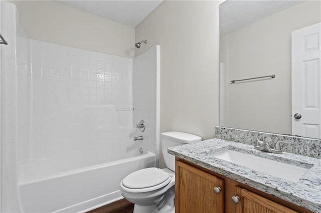 full bathroom featuring vanity, hardwood / wood-style floors, shower / bathtub combination, and toilet