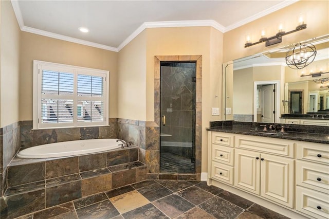 bathroom with a stall shower, crown molding, vanity, a chandelier, and a bath