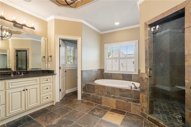 full bathroom with a stall shower, vanity, a garden tub, stone tile flooring, and crown molding