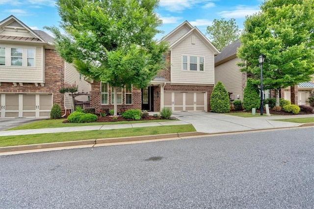 12 Pine St, Roswell, GA 30075 - view of front of home featuring driveway, a garage, and brick siding