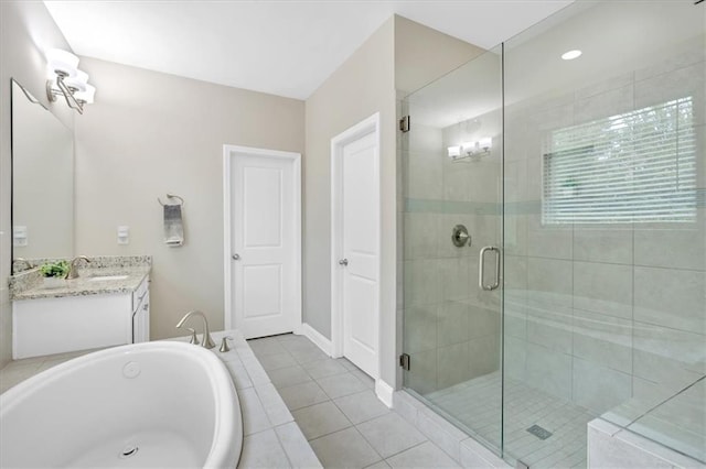 12 Pine St, Roswell, GA 30075 - bathroom featuring a shower stall, vanity, a garden tub, tile patterned flooring, and baseboards