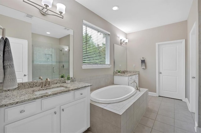 12 Pine St, Roswell, GA 30075 - full bathroom with a stall shower, two vanities, a garden tub, and tile patterned floors