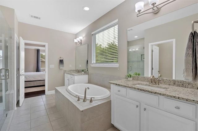 12 Pine St, Roswell, GA 30075 - ensuite bathroom with a shower stall, two vanities, tile patterned floors, a bath, and recessed lighting