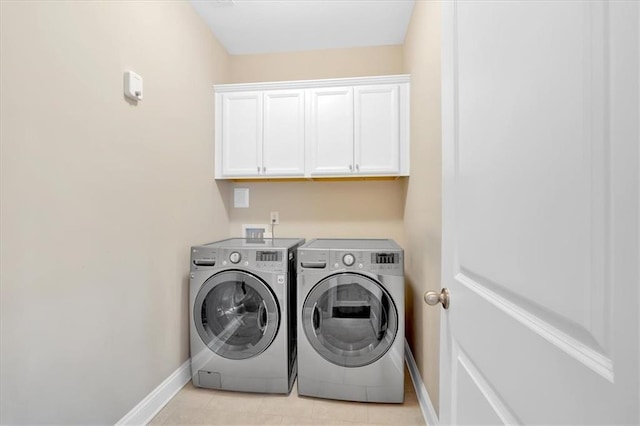 12 Pine St, Roswell, GA 30075 - washroom featuring washing machine and clothes dryer, baseboards, cabinet space, and light tile patterned floors