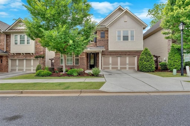 12 Pine St, Roswell, GA 30075 - view of front facade featuring an attached garage, driveway, and brick siding