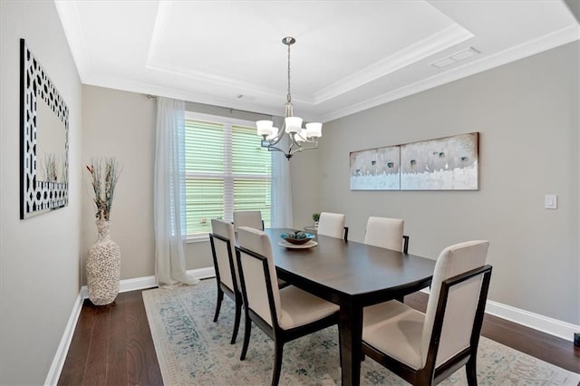 12 Pine St, Roswell, GA 30075 - dining room featuring a raised ceiling, baseboards, a chandelier, wood finished floors, and ornamental molding
