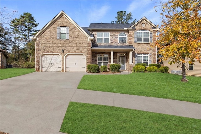 view of front facade with a front yard and a garage