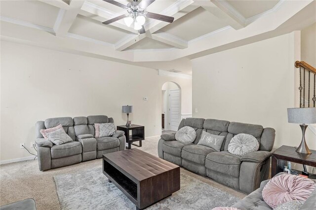 carpeted living room featuring beam ceiling, ceiling fan, crown molding, and coffered ceiling