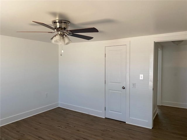 unfurnished bedroom featuring dark hardwood / wood-style floors and ceiling fan